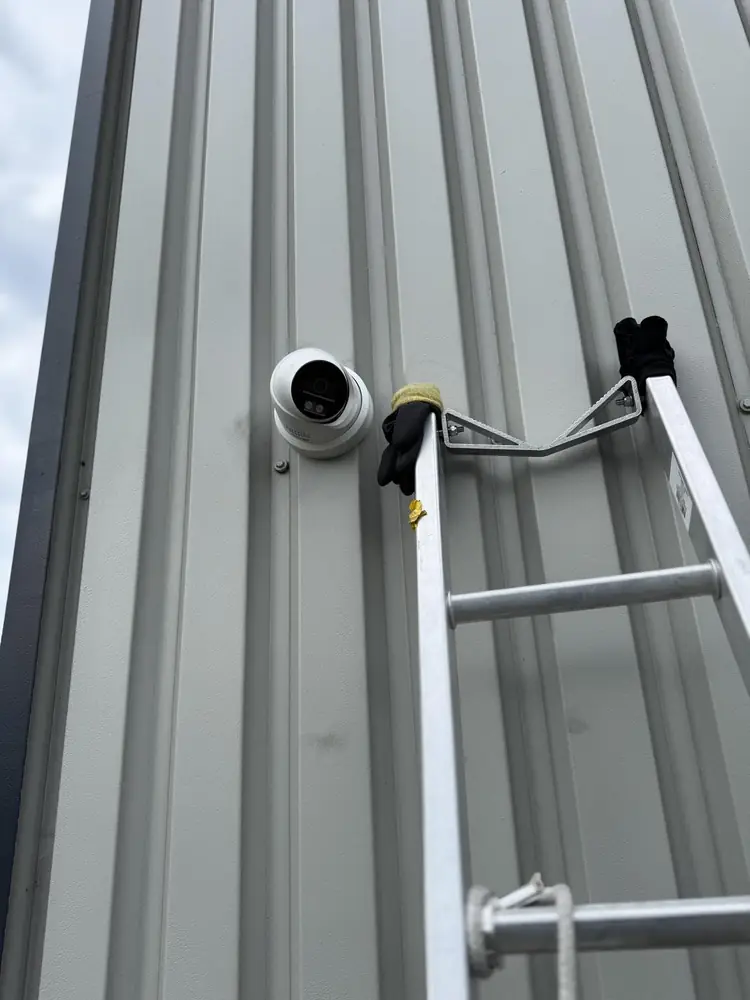 Turret camera being fitted to the cladding of an industrial unit