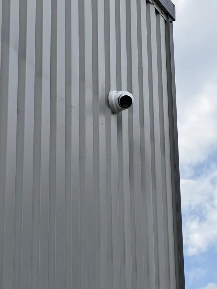 Finished turret camera on grey cladding